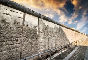 Remains of the Berlin Wall preserved along Bernauer Strasse at sunset